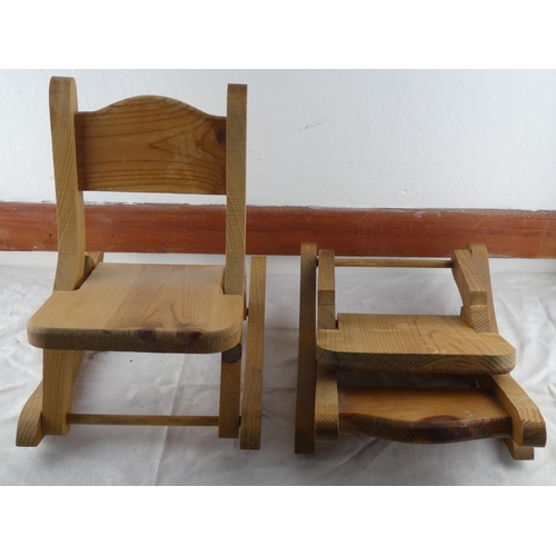 74 - A pair of pine miniature rocking chairs.