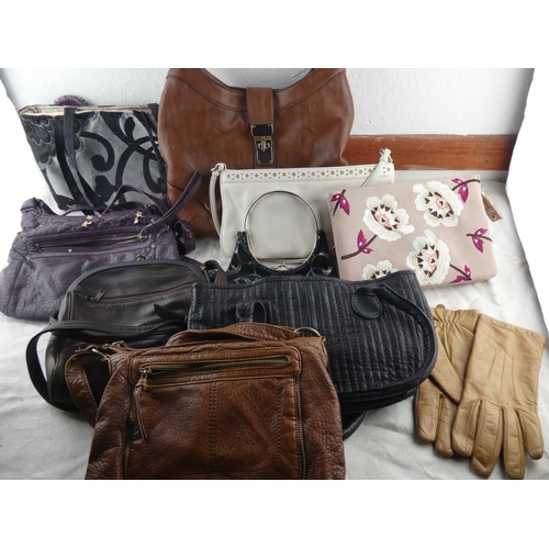 79 - A collection of various handbags.