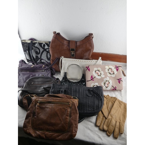 79 - A collection of various handbags.
