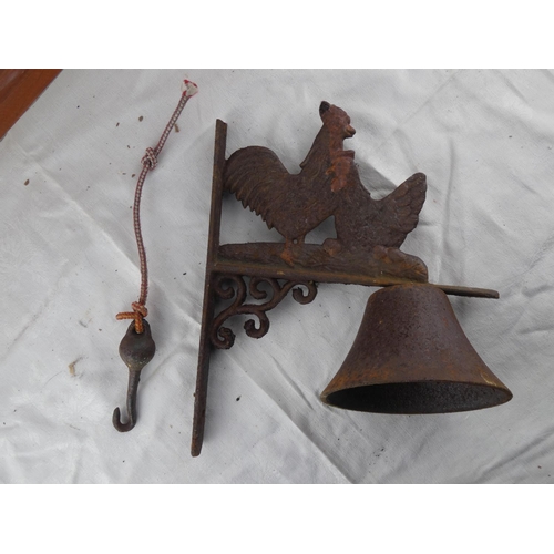 84 - A cast iron 'Hen' wall bracket and bell.