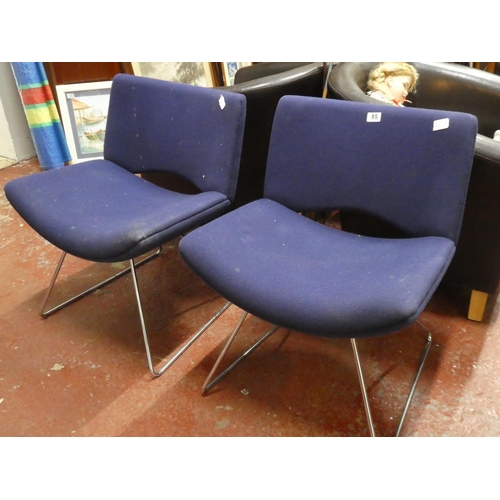 85 - A pair of vintage upholstered chairs.