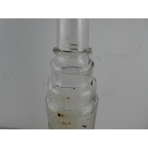 94 - A vintage Essolube glass bottle.