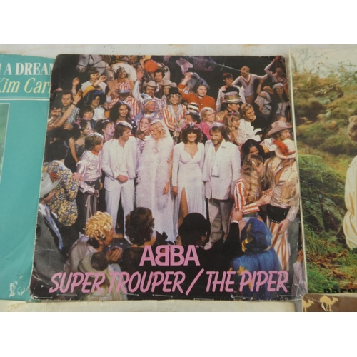155 - A collection of 45's to include ABBA, Rod Stewart and Mac Davis.