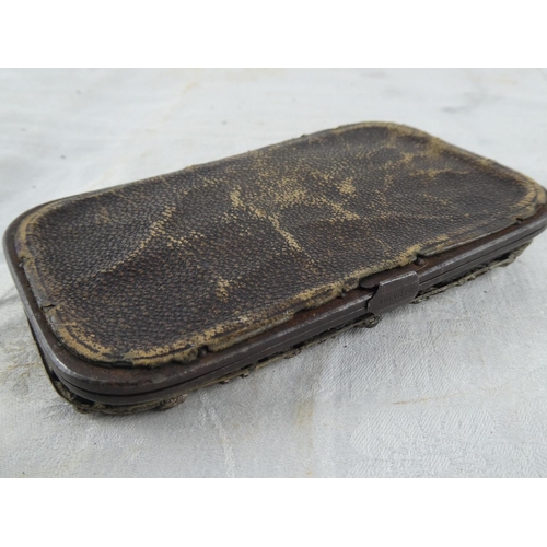 162 - A stunning antique leather purse with decorative metal cover, in need of some restoration.