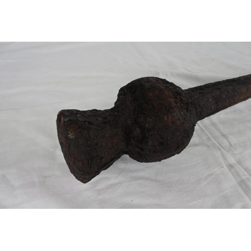 117 - An antique bell clanger. (measuring 54cm).