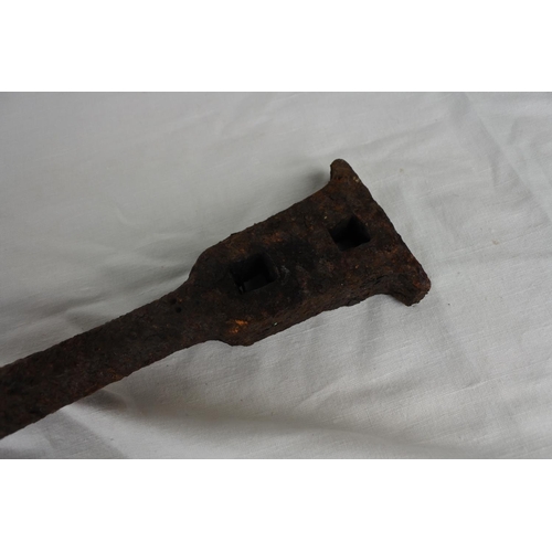 117 - An antique bell clanger. (measuring 54cm).