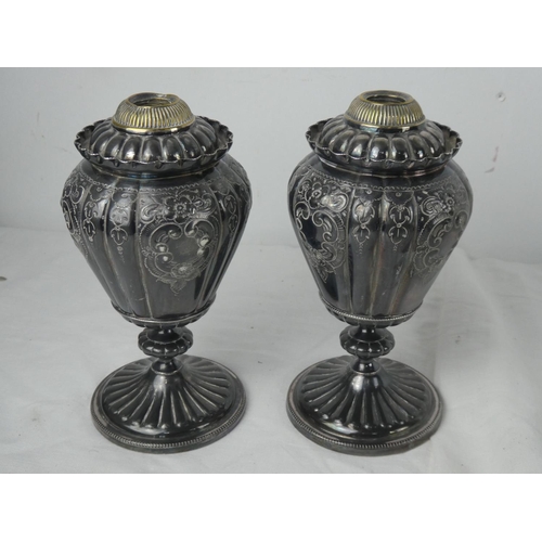 51 - A stunning pair of silver plated oil lamp bases.