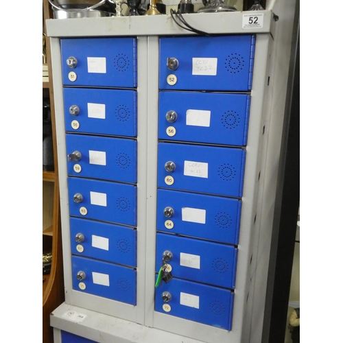 52 - A metal storage cabinet with 12 lockable compartments (some with keys).