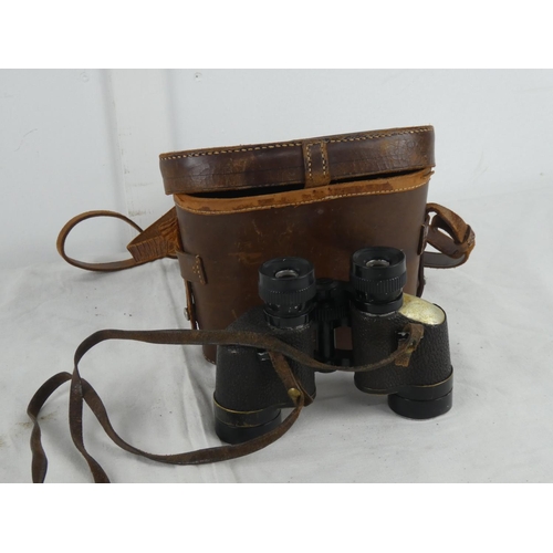 65 - A vintage leather cased set of Wollensa 8 x 30 binoculars.