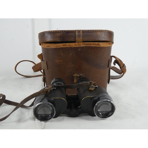 65 - A vintage leather cased set of Wollensa 8 x 30 binoculars.