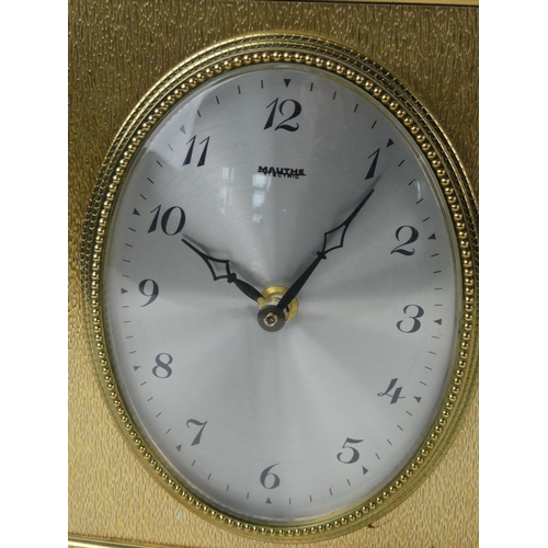 66 - A vintage metal cased 'Mauthe' mantle clock.