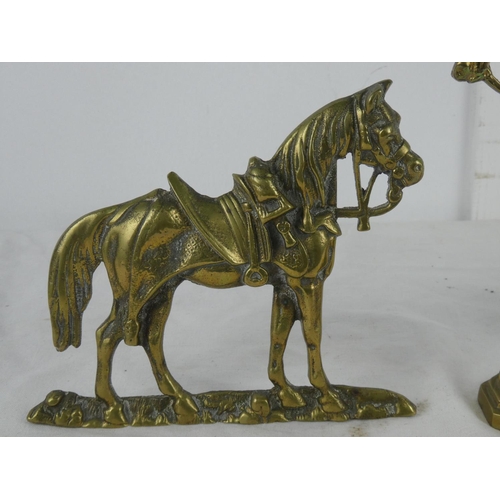 76 - Two brass horse ornaments.