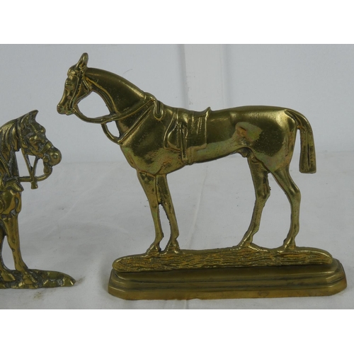 76 - Two brass horse ornaments.