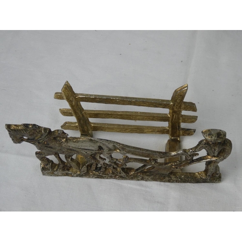 77 - A brass letter rack.