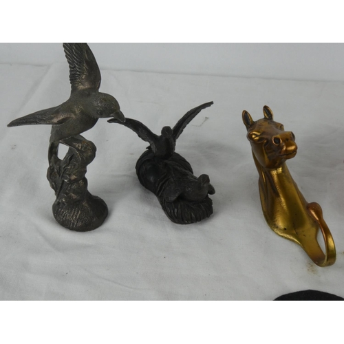 80 - A brass horse head clothes hook and an assortment of various Rosette's & badges etc and more.