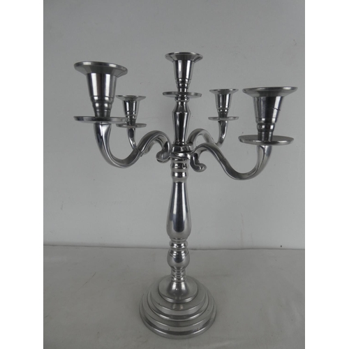 454 - A four branch silver metal candelabra.