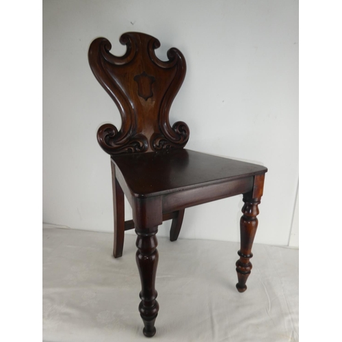 459 - A stunning antique shield back chair.