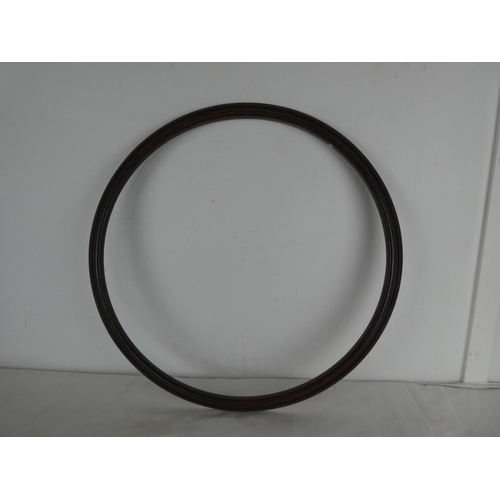 462 - A large circular wooden ring/ hoop.