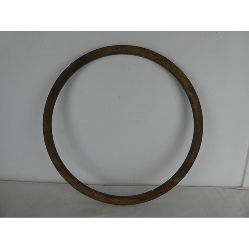 462 - A large circular wooden ring/ hoop.