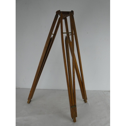 464 - An antique pine tripod stand.