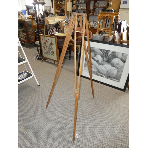 464 - An antique pine tripod stand.