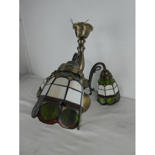 470 - A three branch ceiling light with colour leaded glass shades.