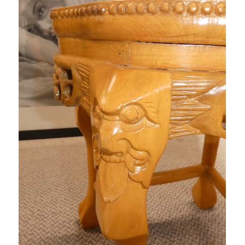 475 - A marble topped table with carved detail.