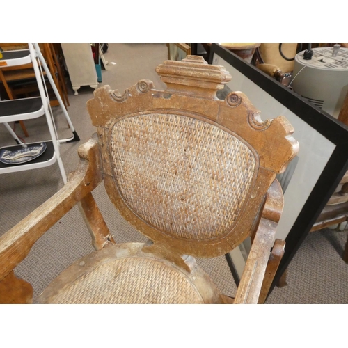 481 - A stunning antique oak high chair on cast iron rollers.