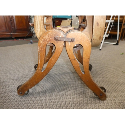 481 - A stunning antique oak high chair on cast iron rollers.