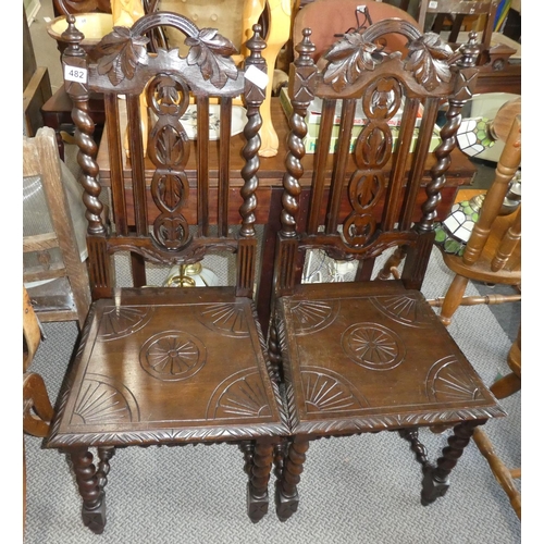 482 - A stunning pair of antique oak hall chairs with barley twist legs.