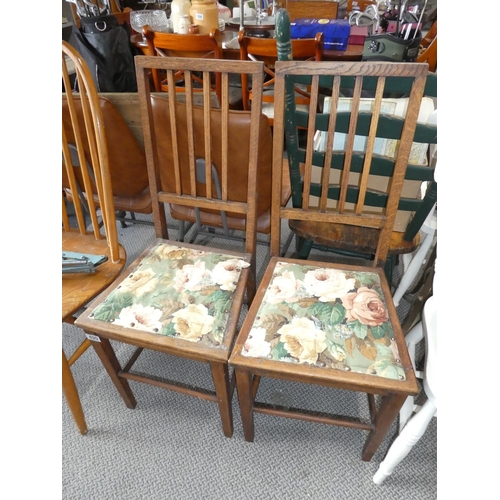 490 - A pair of oak framed rail back chairs.