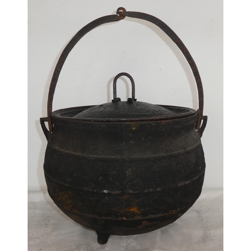 493 - A superb three legged black pot and lid.