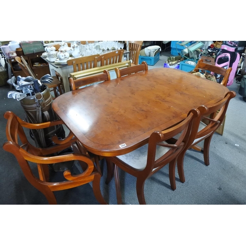 504 - An inlaid dining table and matching six chairs.