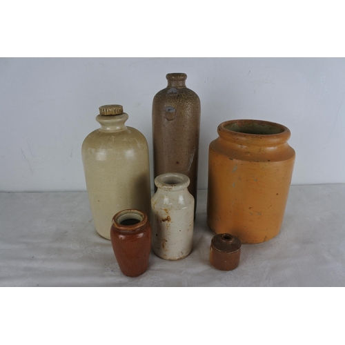 506 - A lot of stoneware bottles and containers.