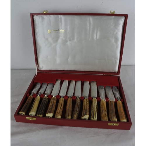 512 - A stunning boxed set of Cooper Brothers bone handled style dinner knives and forks.