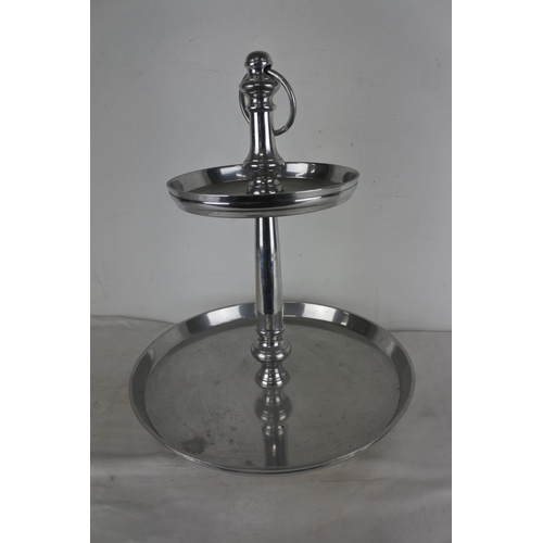 514 - A large two tier silver metal cake stand/centre piece.