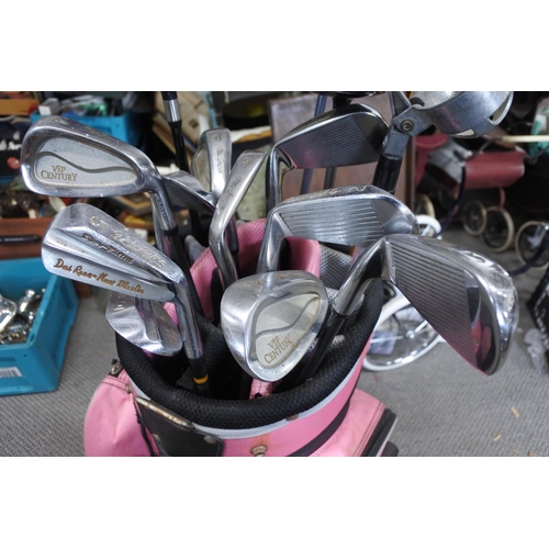 522 - A set of golf clubs to include a MD 10.5 driver, a King Cobra and two MD drivers, also Dia Rees iron... 