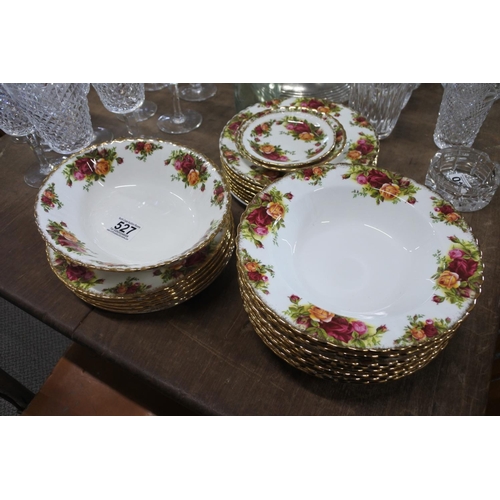 527 - A large collection of Royal Albert Old Country Rose to include dinner plates, soup bowls and more.