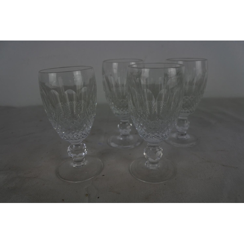 528 - A set of four crystal sherry glasses.