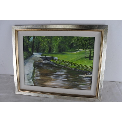 535 - An unsigned oil painting of a river scene.