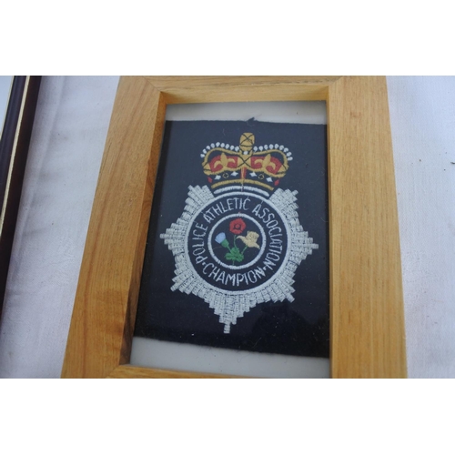 546 - A framed 'Police Athletic Association Champion' fabric badge and more.