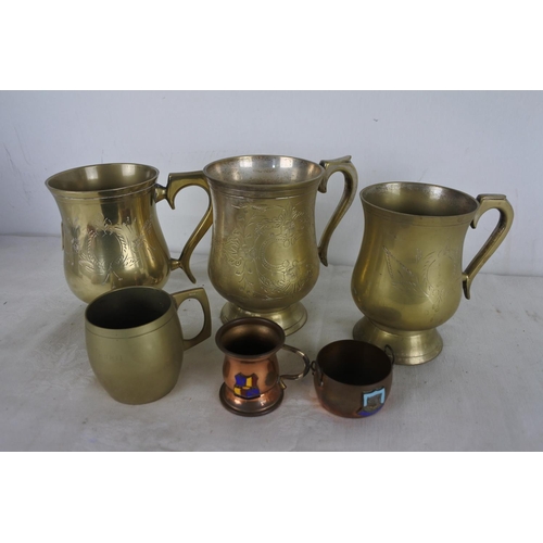 549 - A lot of three silver plated tankards and more.