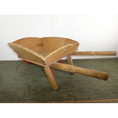 554 - A stunning vintage child's wheelbarrow.