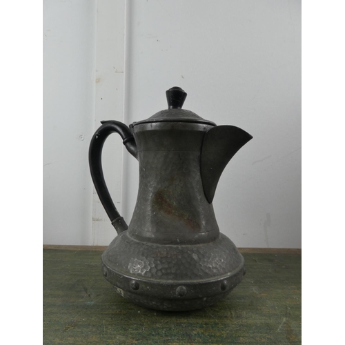 577 - An antique pewter coffee pot.