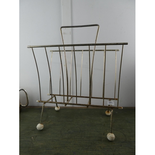 580 - A vintage metal framed magazine rack.