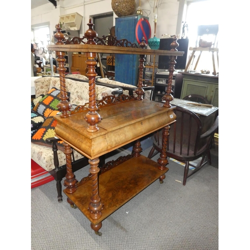 581 - A stunning antique walnut whatnot with hidden writing slope.