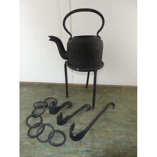 585 - A collection of wrought iron ware to include pot stand, hooks etc.