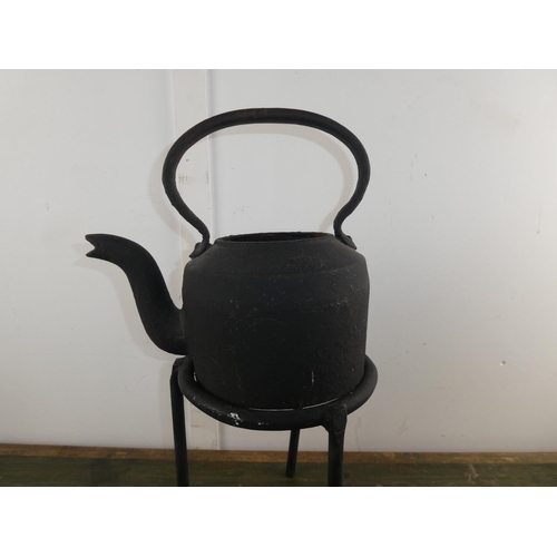 585 - A collection of wrought iron ware to include pot stand, hooks etc.