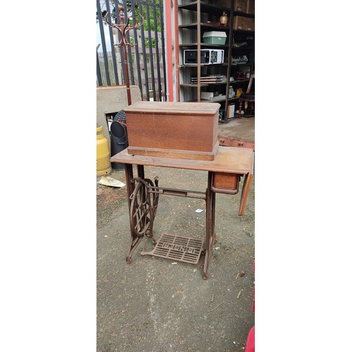 5 - An antique Singer Sewing machine table.