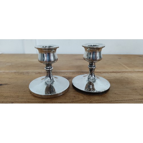 567 - A pair of Sterling Silver candlesticks stamped for Birmingham - 'S.B & S. Ld'.